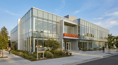 Wells Fargo Investment Center building with glass facade and landscaped surroundings